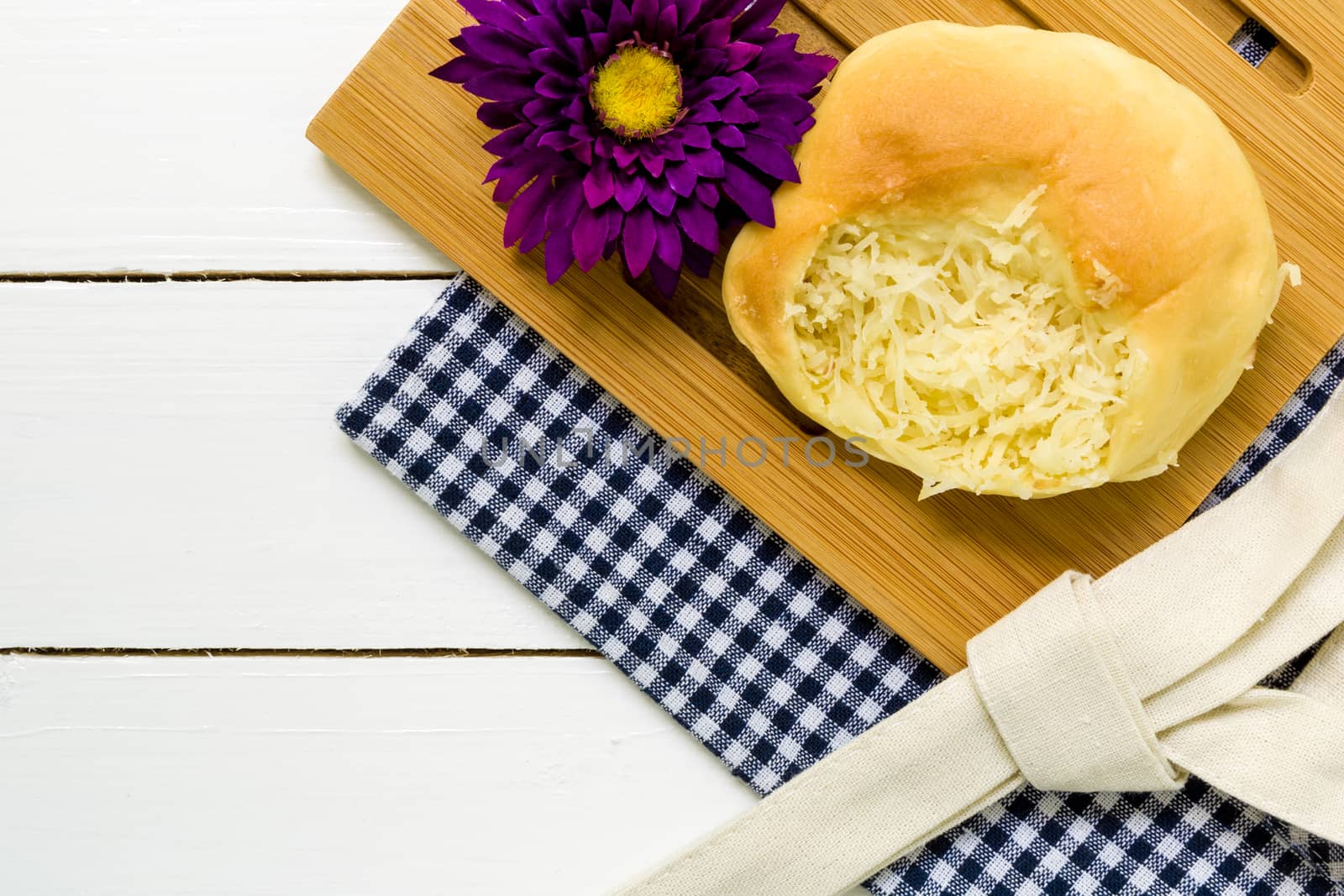 Coconut bun with cup of coffee for breakfast background.