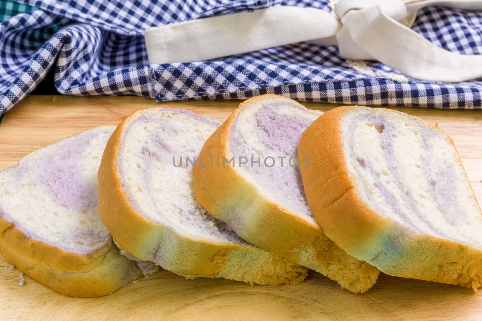 Taro bread for breakfast on vintage wooden background.