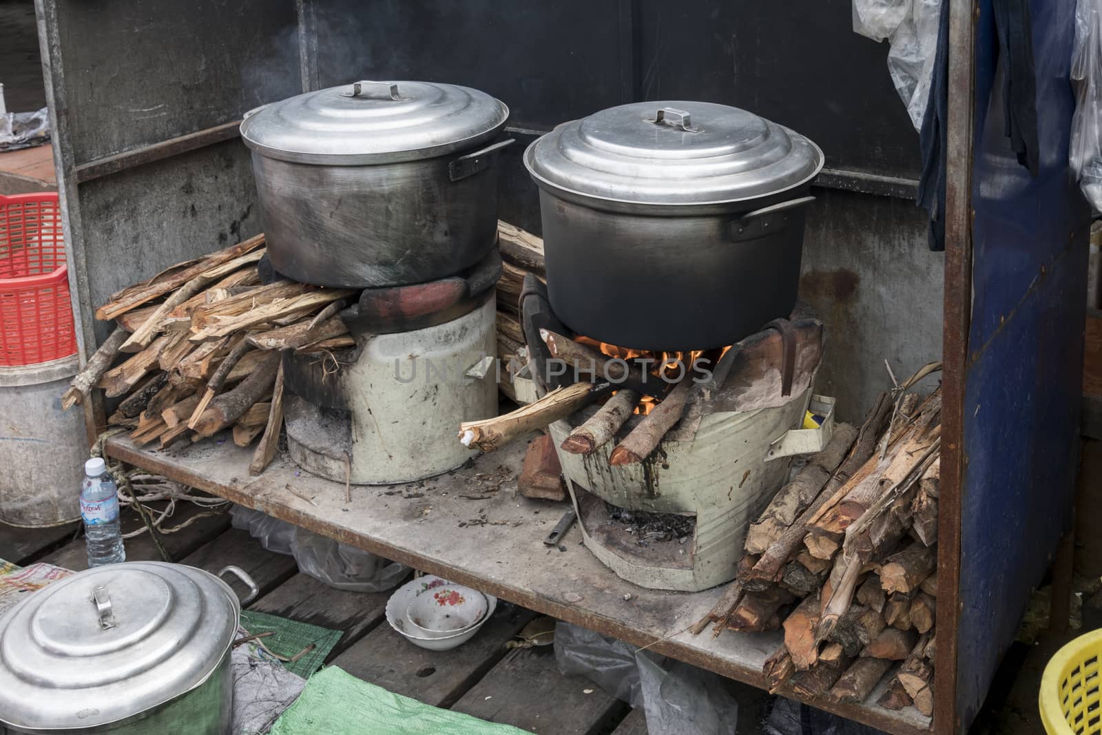 Fish cooking station on wood fire at the famous Crab Market of Kep, Cambodia