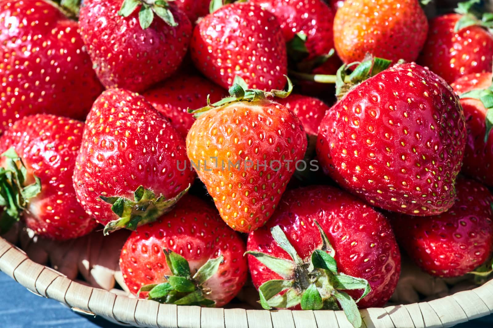 Strawberries in a wicker basket during spring in Poland