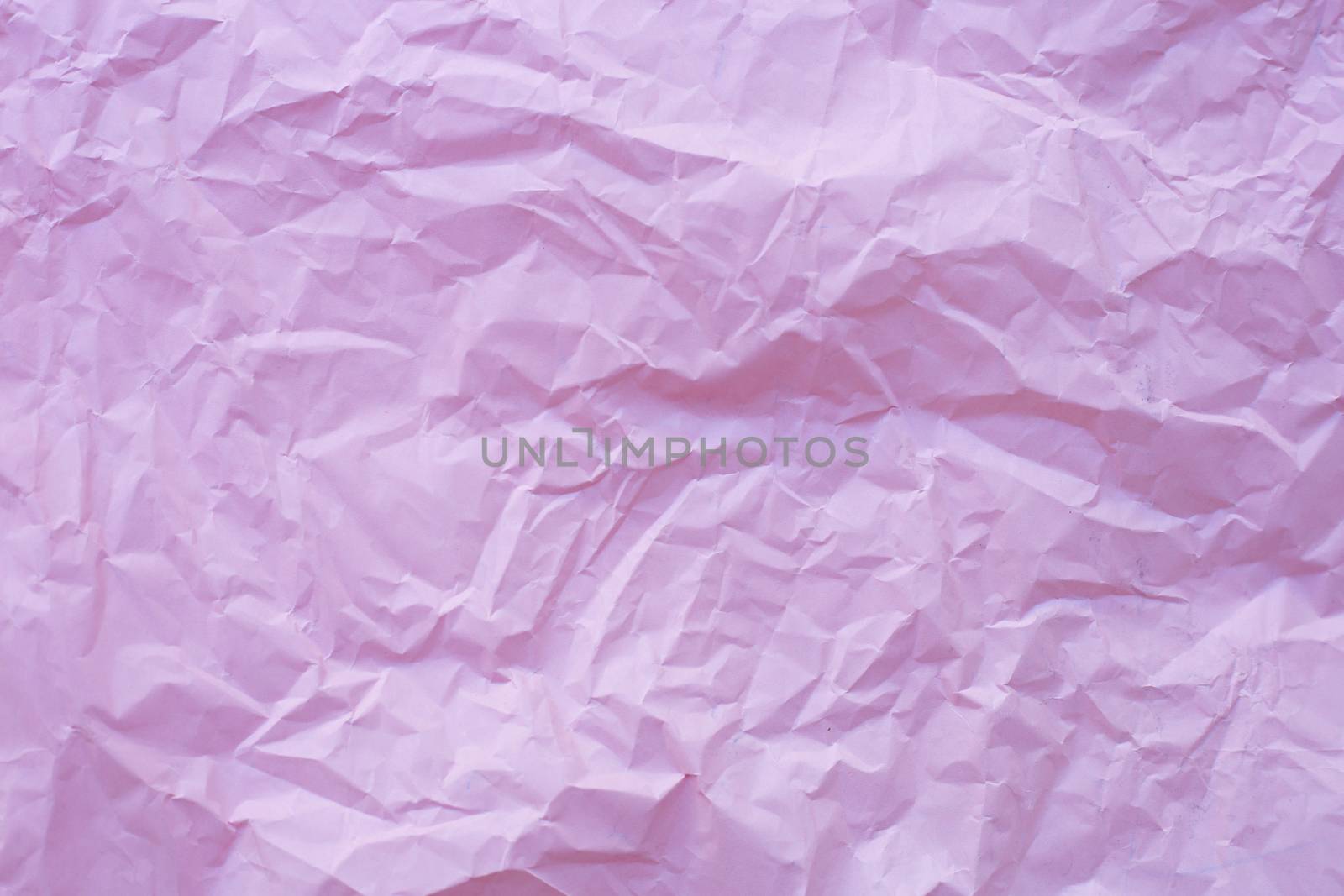 Pink crumpled recycle paper background