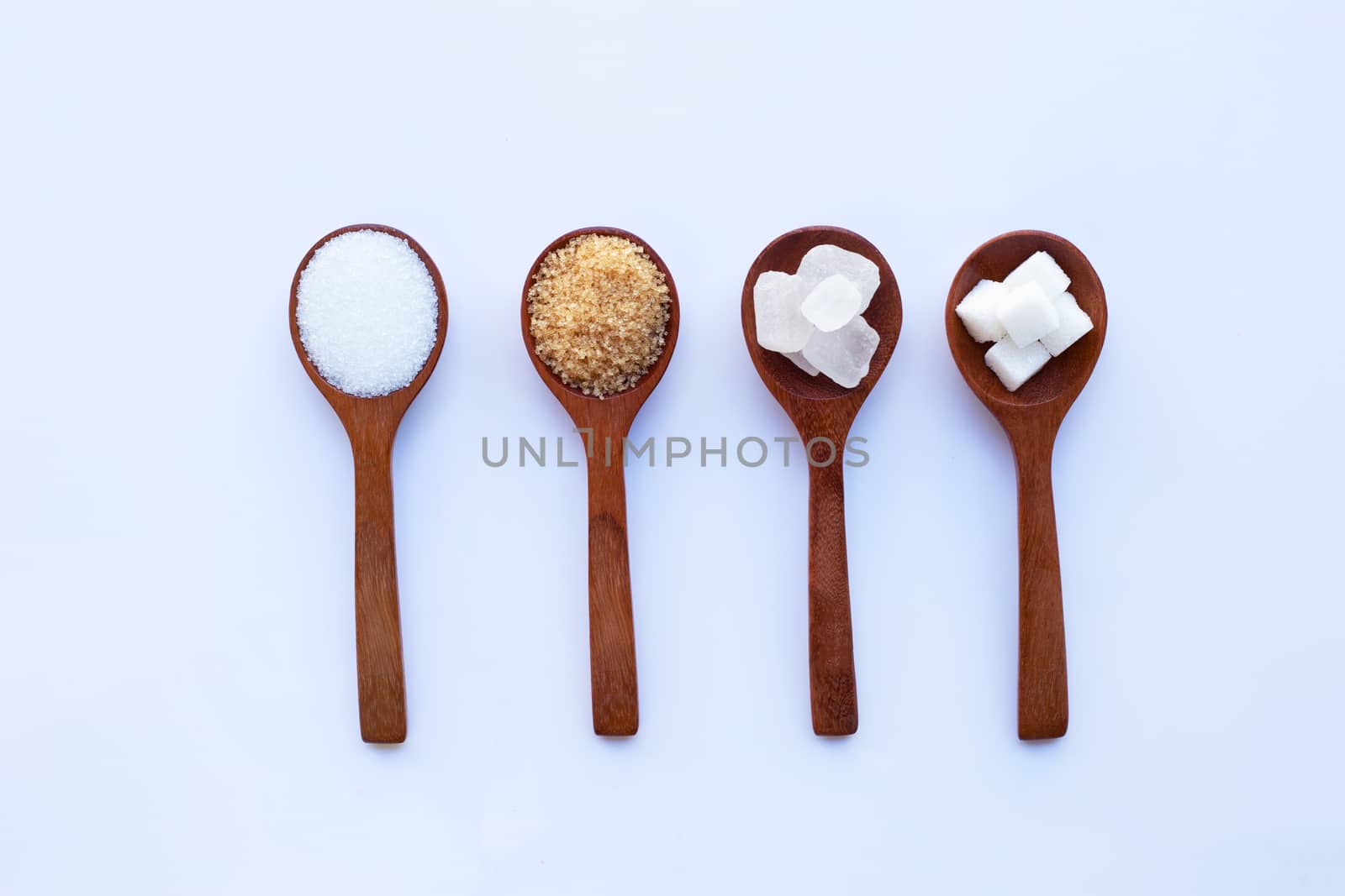 Various types of sugar on white background.