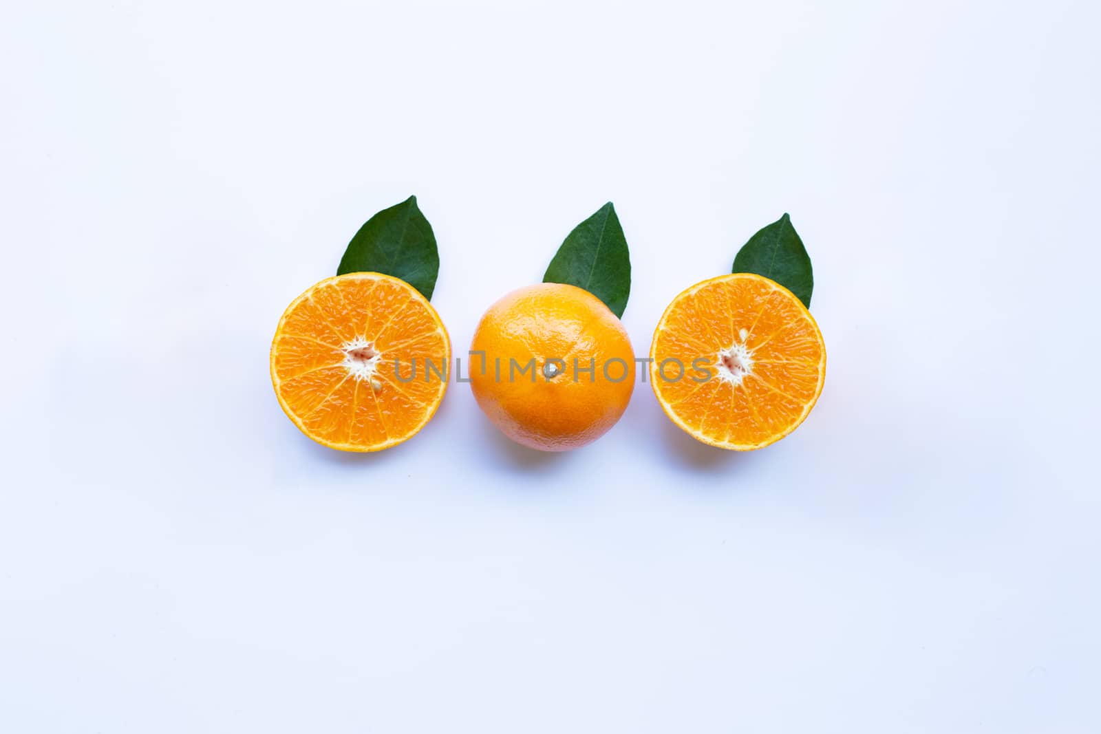 Fresh orange citrus fruit with leaves isolated on white background.  Top view