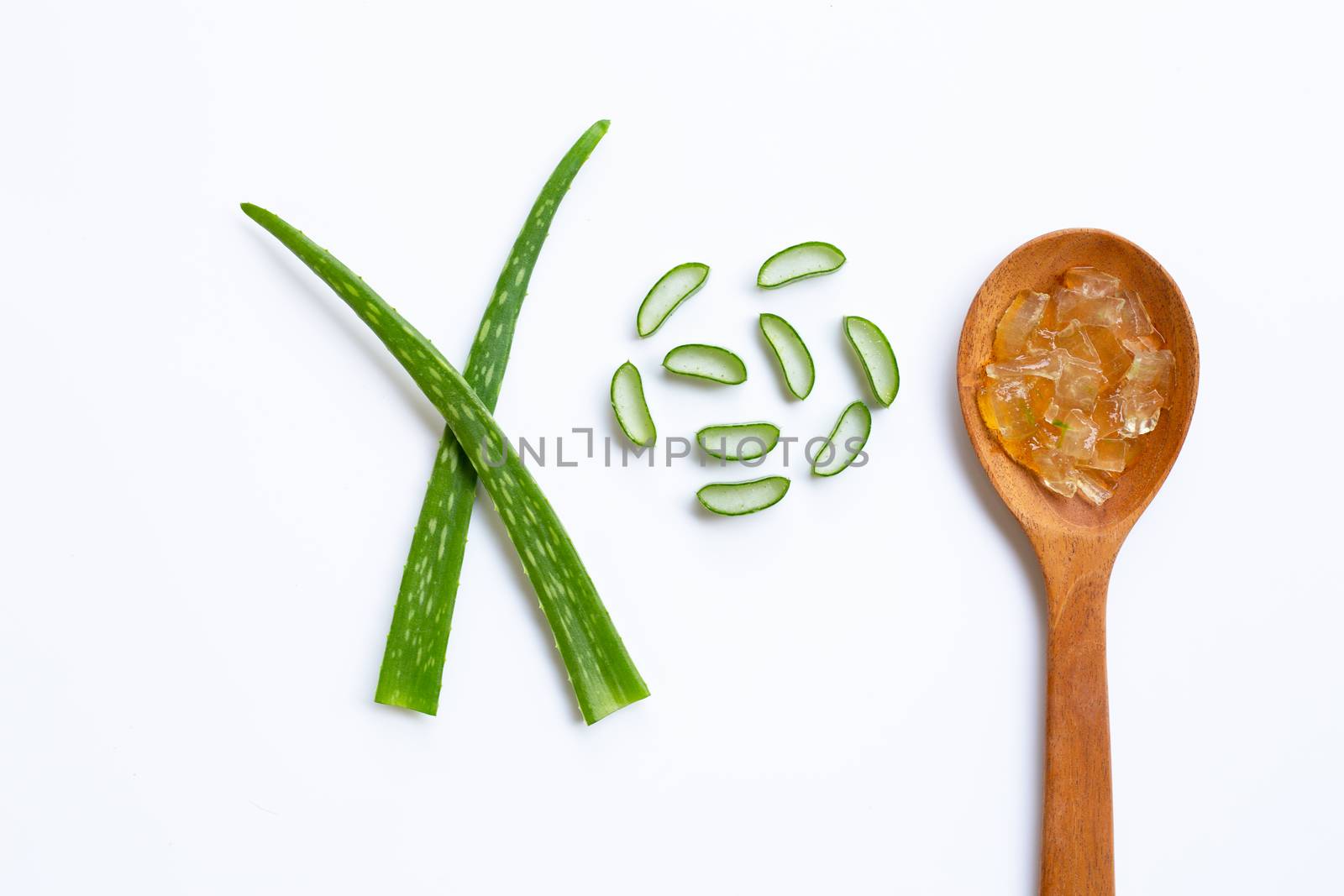 Aloe vera gel on wooden spoon with aloe vera on white background
