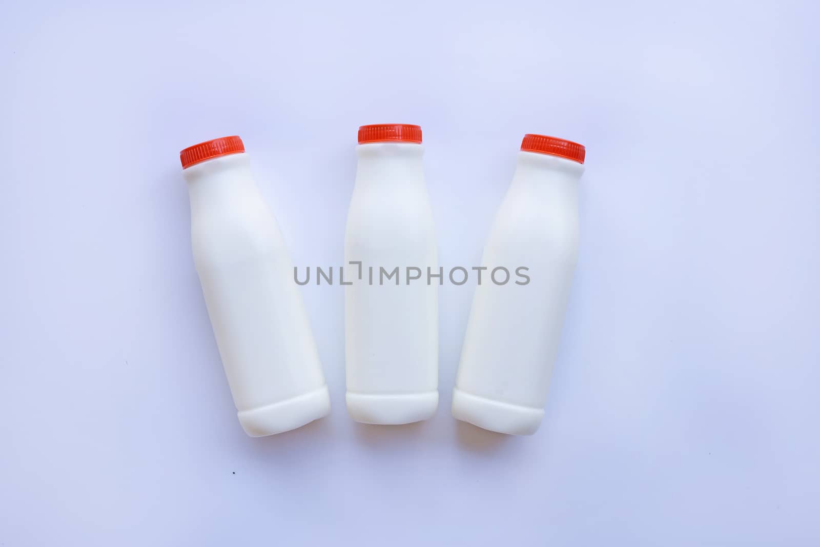 milk bottle on over white background