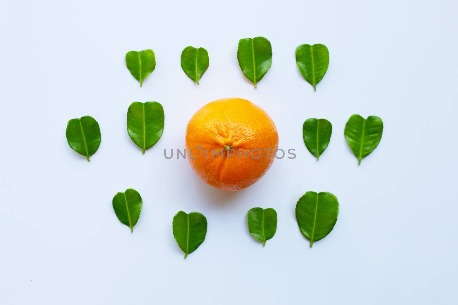 Fresh oranges with half of Bergamot kaffir lime leaves, heart shape on white background