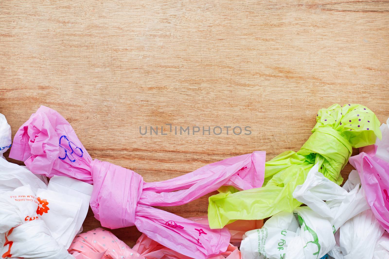 Plastic waste , Plastic bags on wooden background.