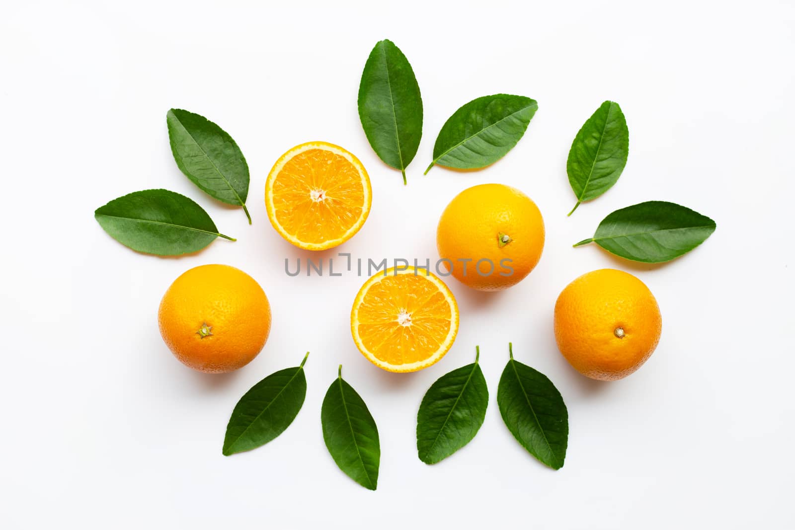 Oranges and green leaves on white background.