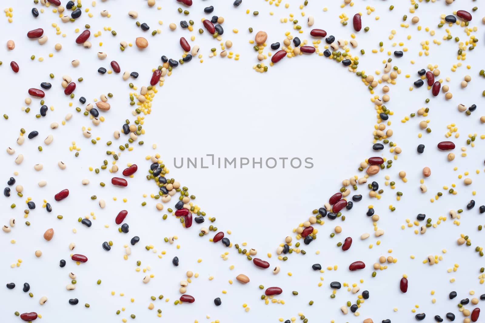Mixed beans, Different legumes isolated on white background.  heart shaped