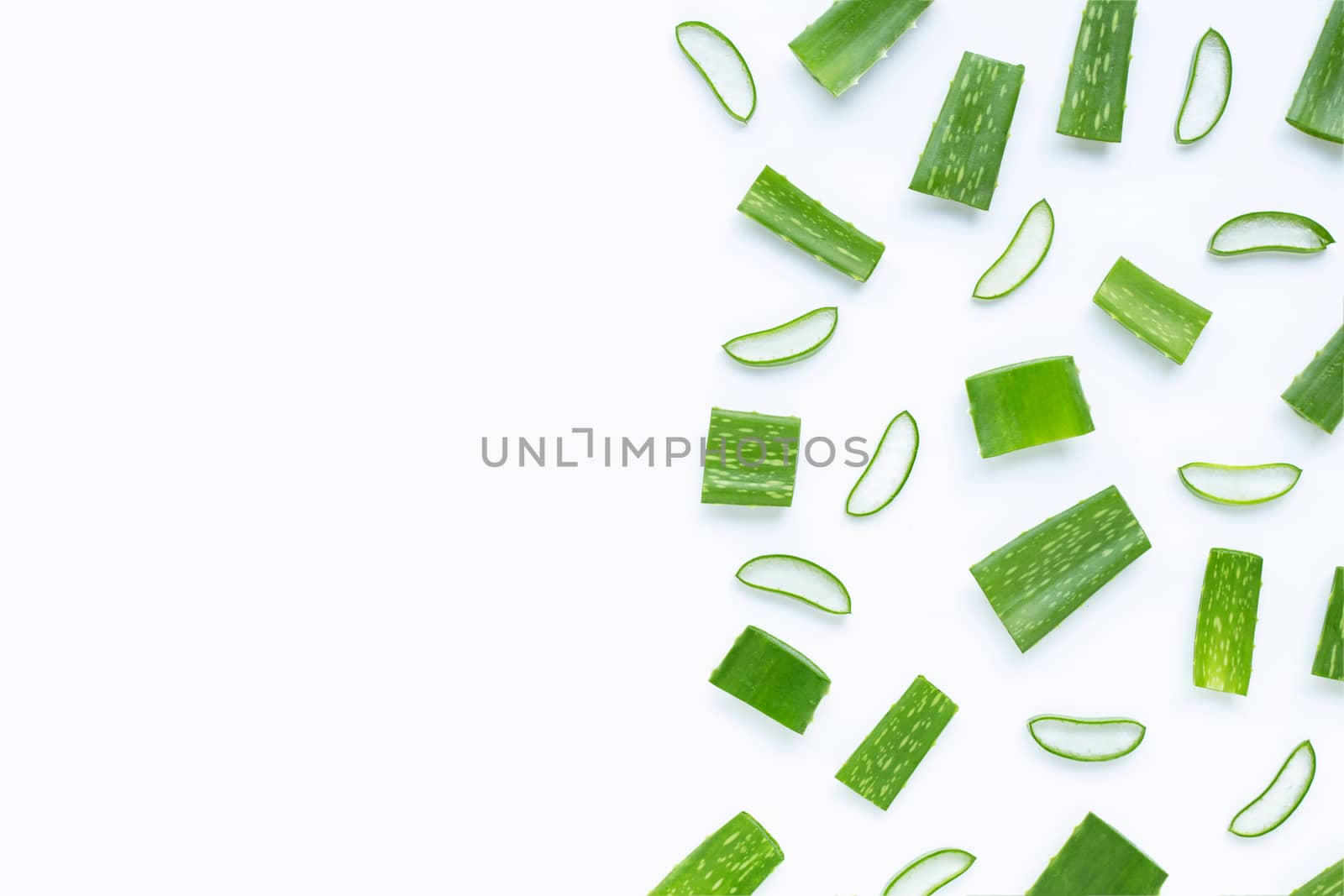 Aloe Vera cut pieces with slices on  white background. Copy space