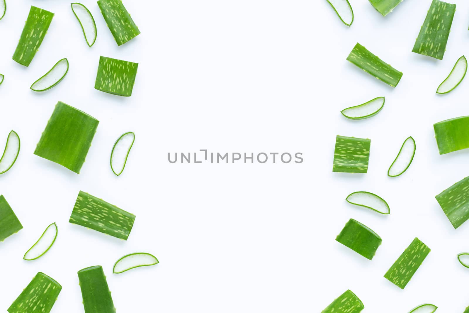 Frame made of Aloe Vera cut pieces with slices on  white background. Copy space