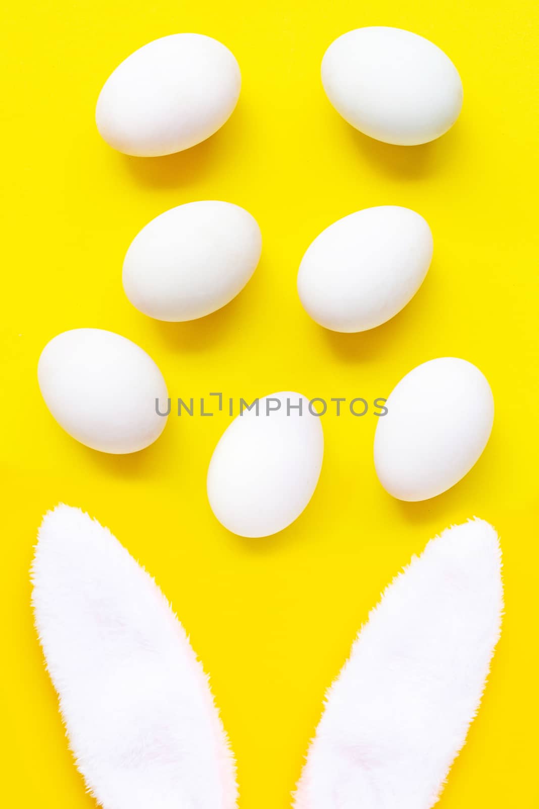 Fresh eggs on yellow background.  by Bowonpat