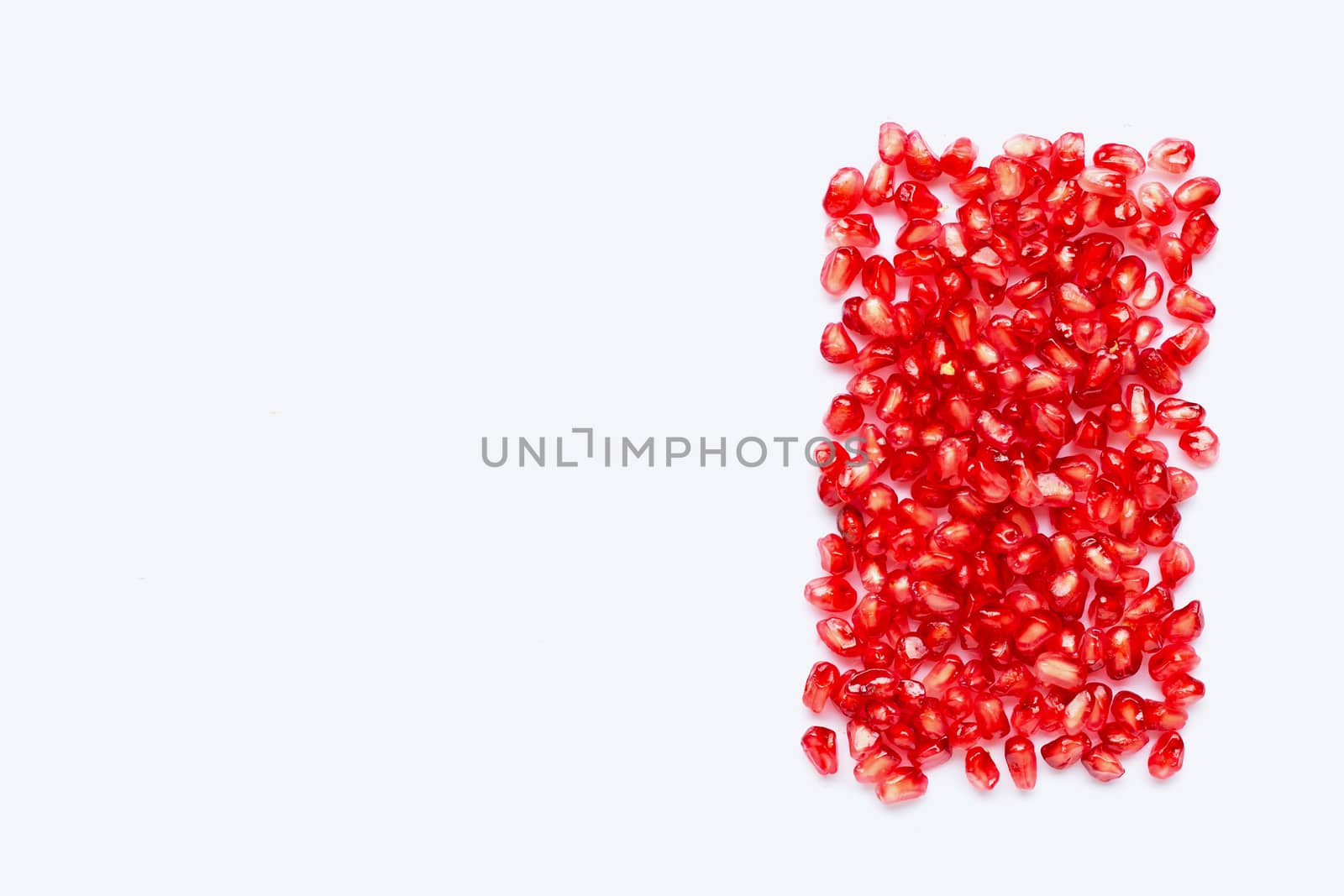 pomegranate seeds isolated on white background. Copy space