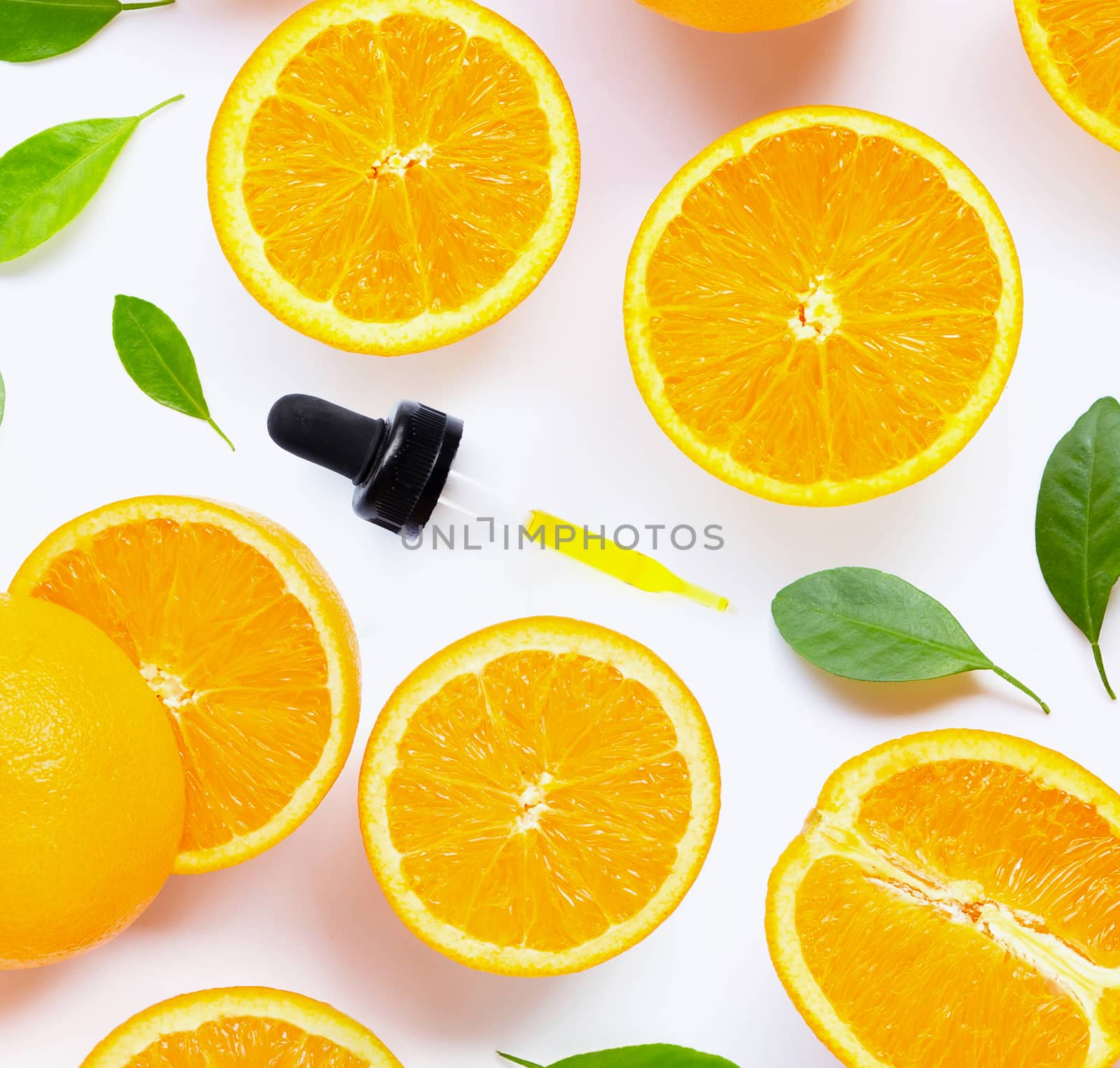 Citrus essential oil with fresh orange fruit isolated on white background.