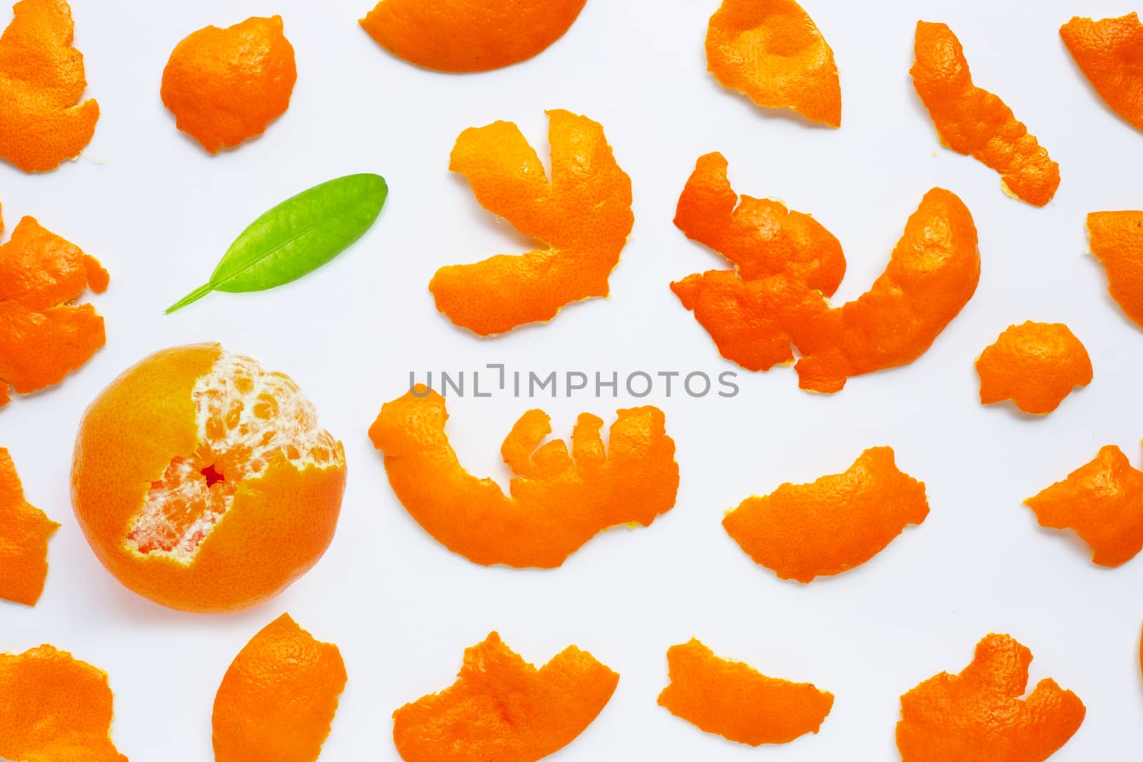 Orange with peel on white background. Top view