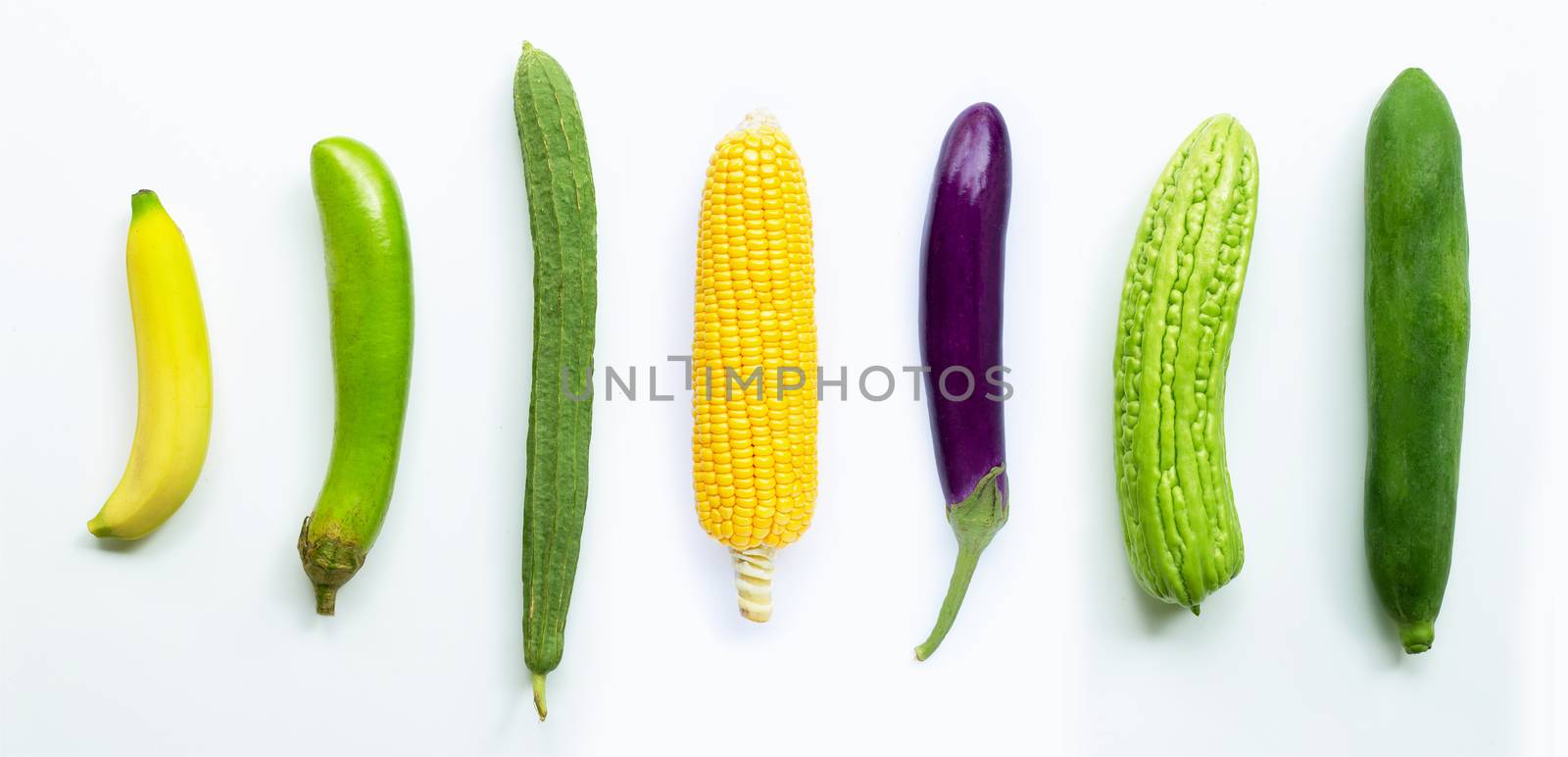 Banana, eggplant, corn, luffa acutangula, bitter melon,  green papaya on white background.