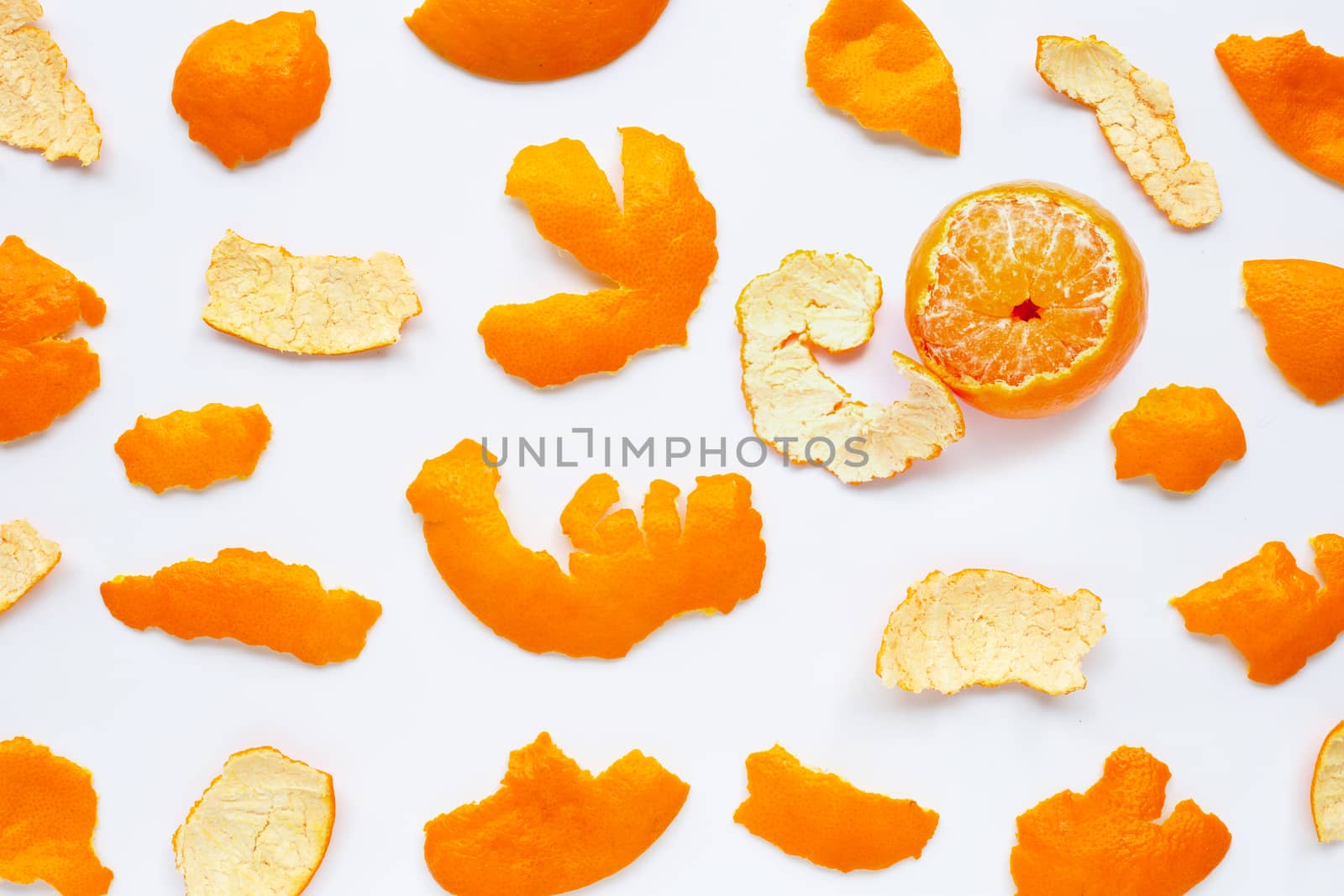 Orange with peel on white background. Top view