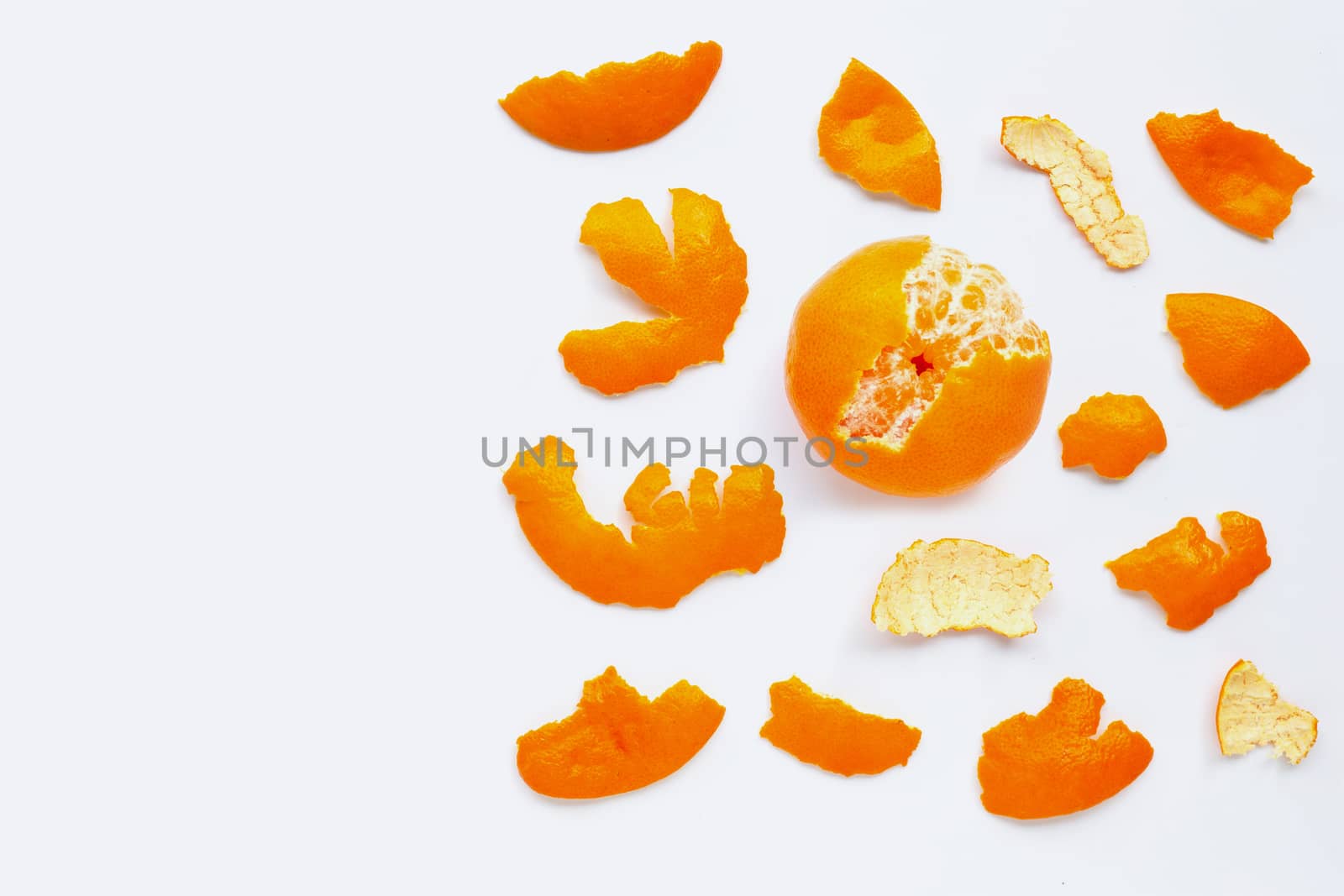 Orange with peel on white background.  Copy space
