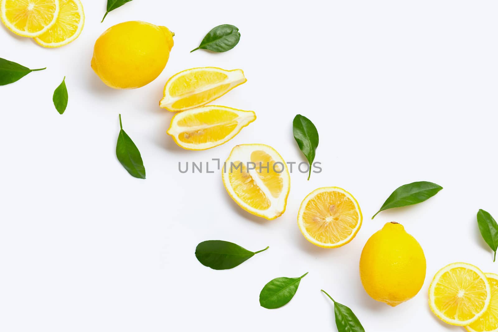 Fresh lemon with green leaves on white background.