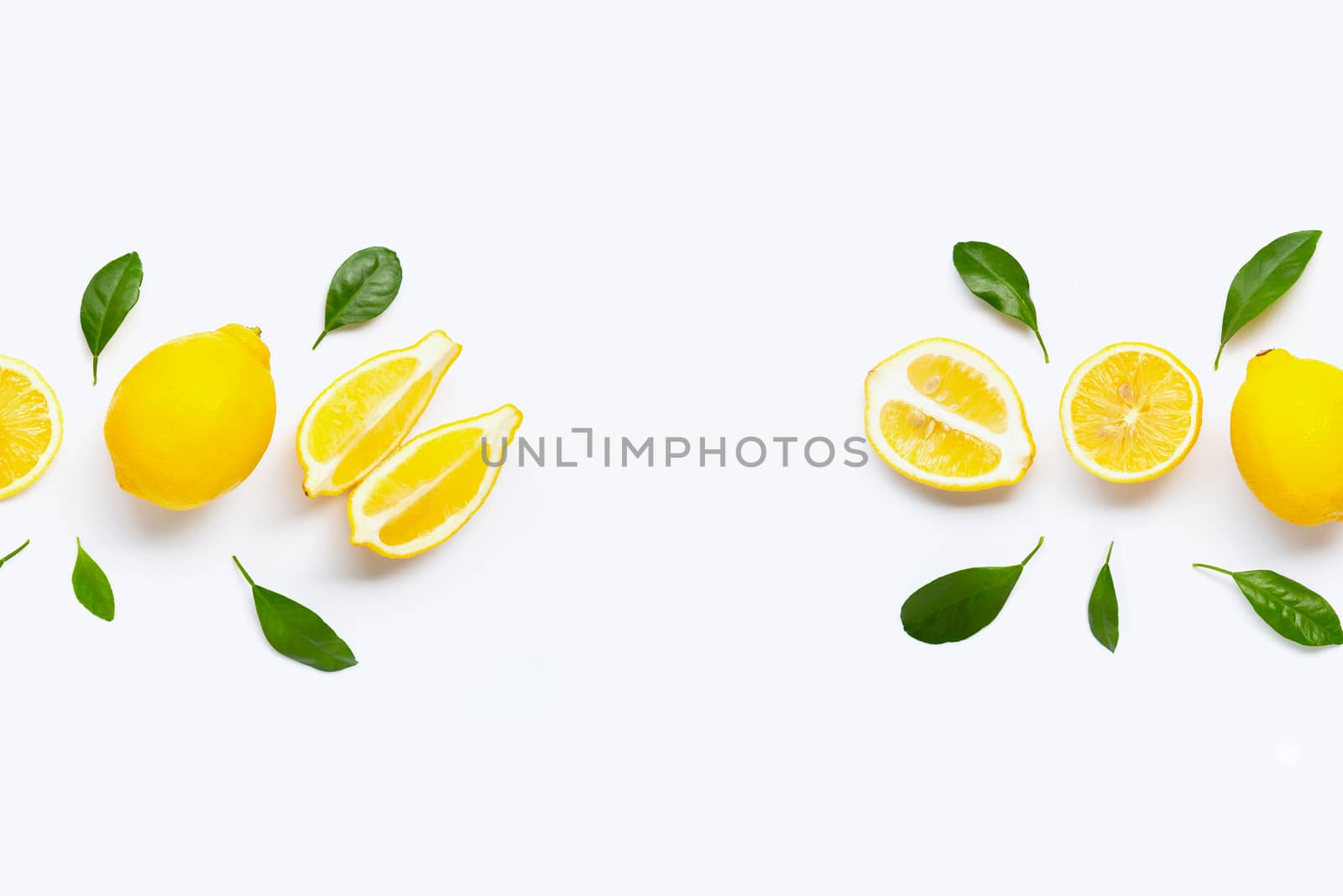 Fresh lemon with green leaves on white background.