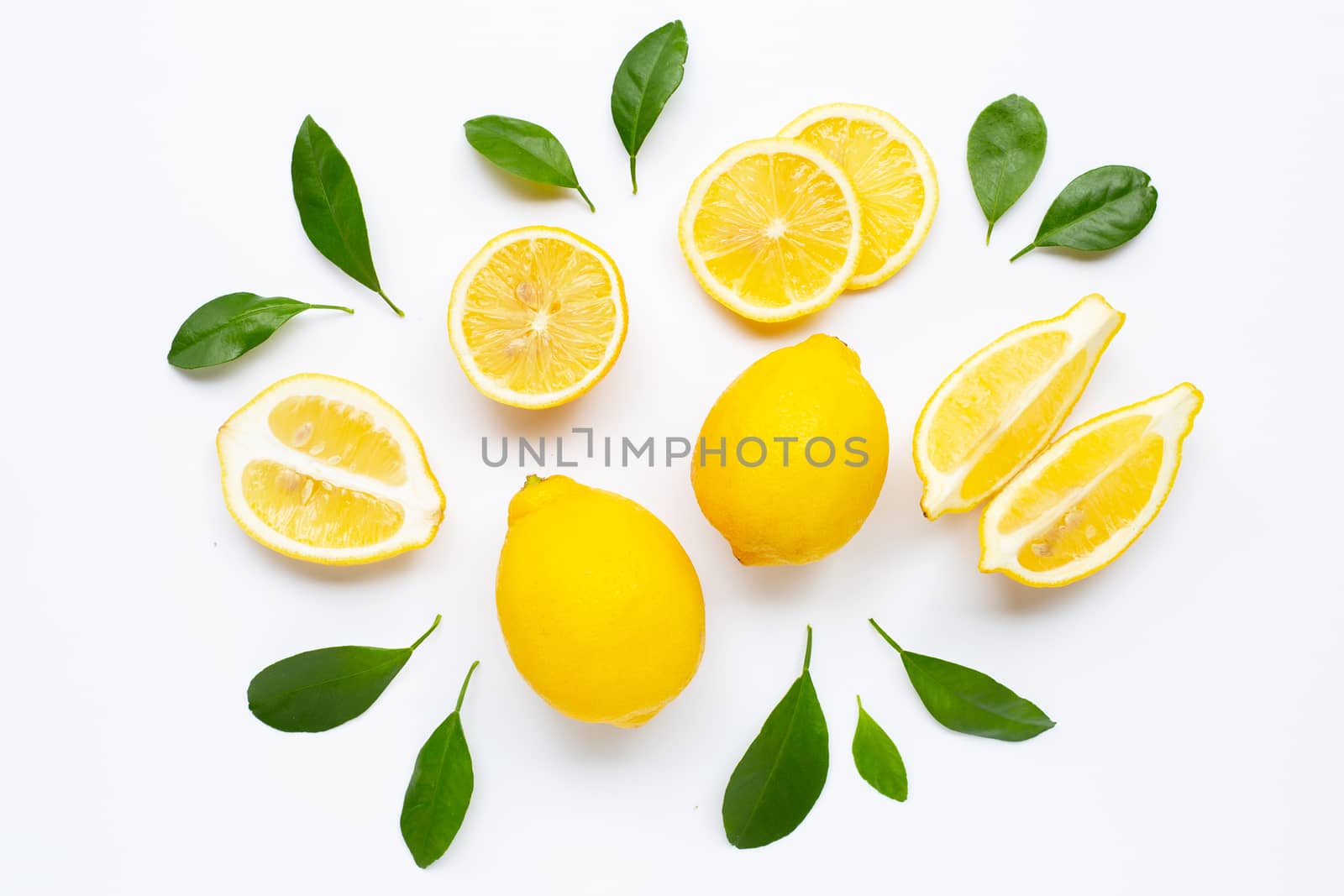 Fresh lemon with green leaves on white background.