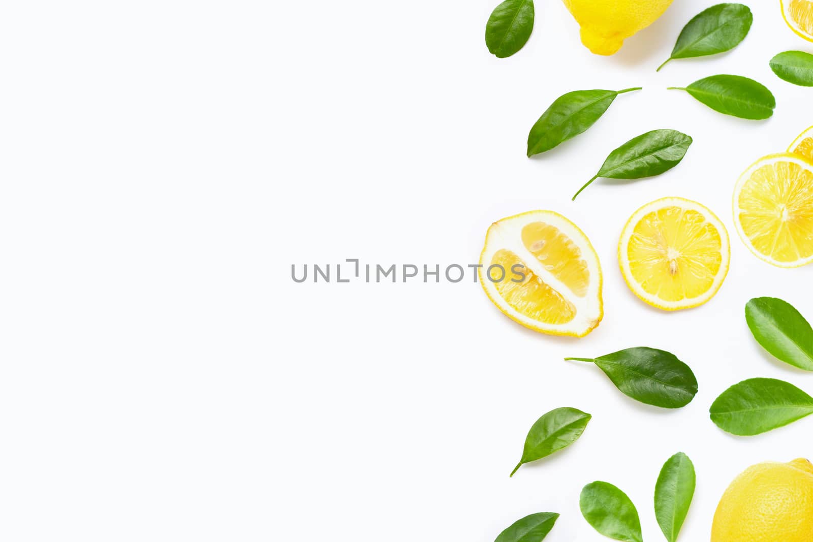 Fresh lemon with green leaves on white background.