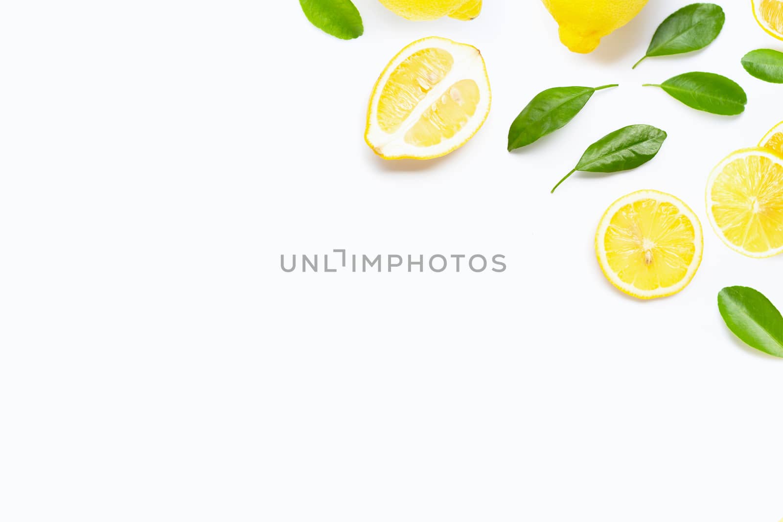 Fresh lemon with green leaves on white background.