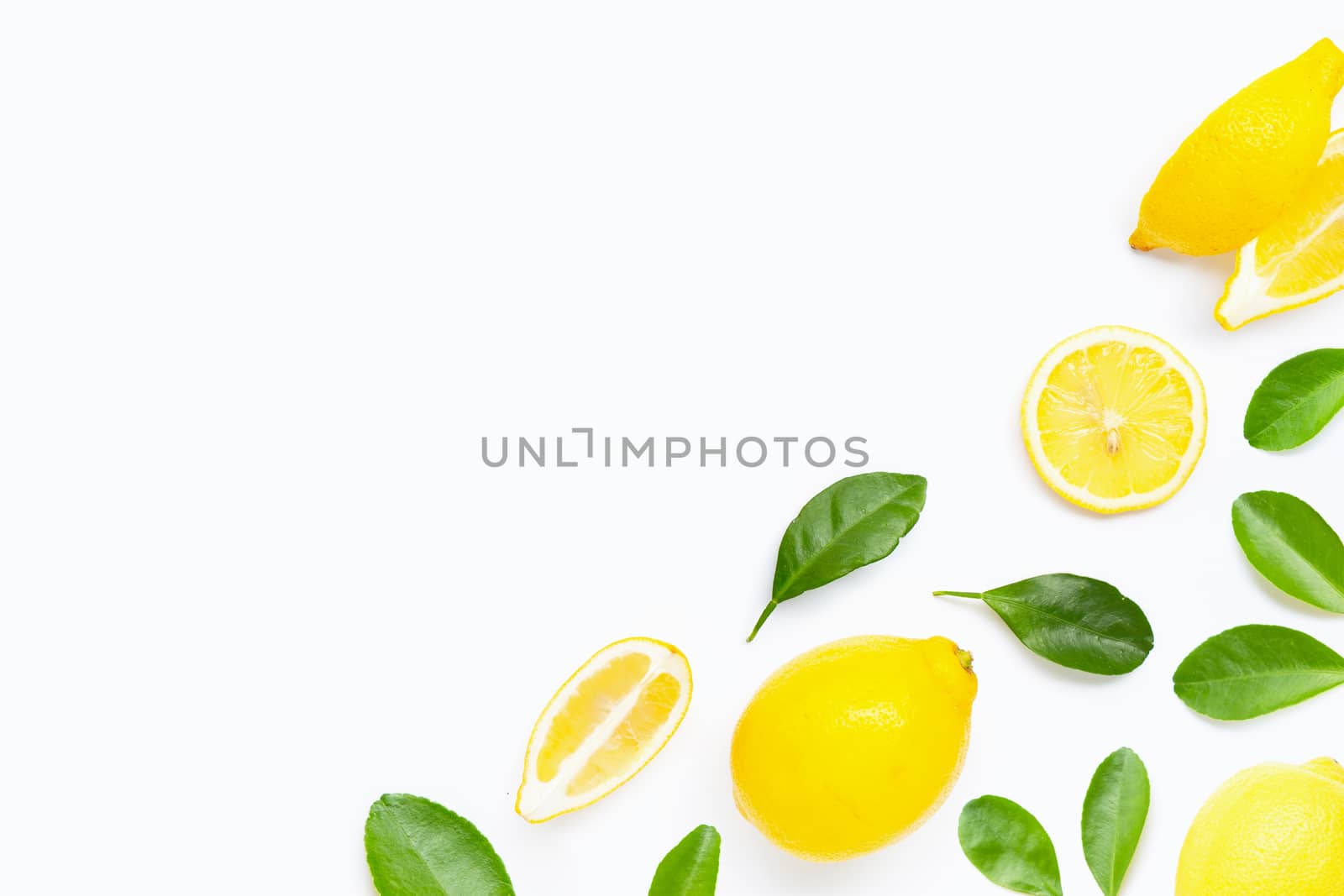 Fresh lemon with green leaves on white background.