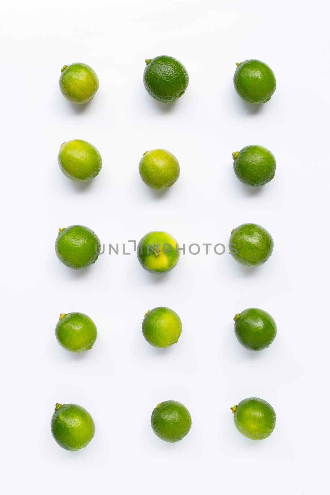 Fresh limes  isolated on white background. Top view