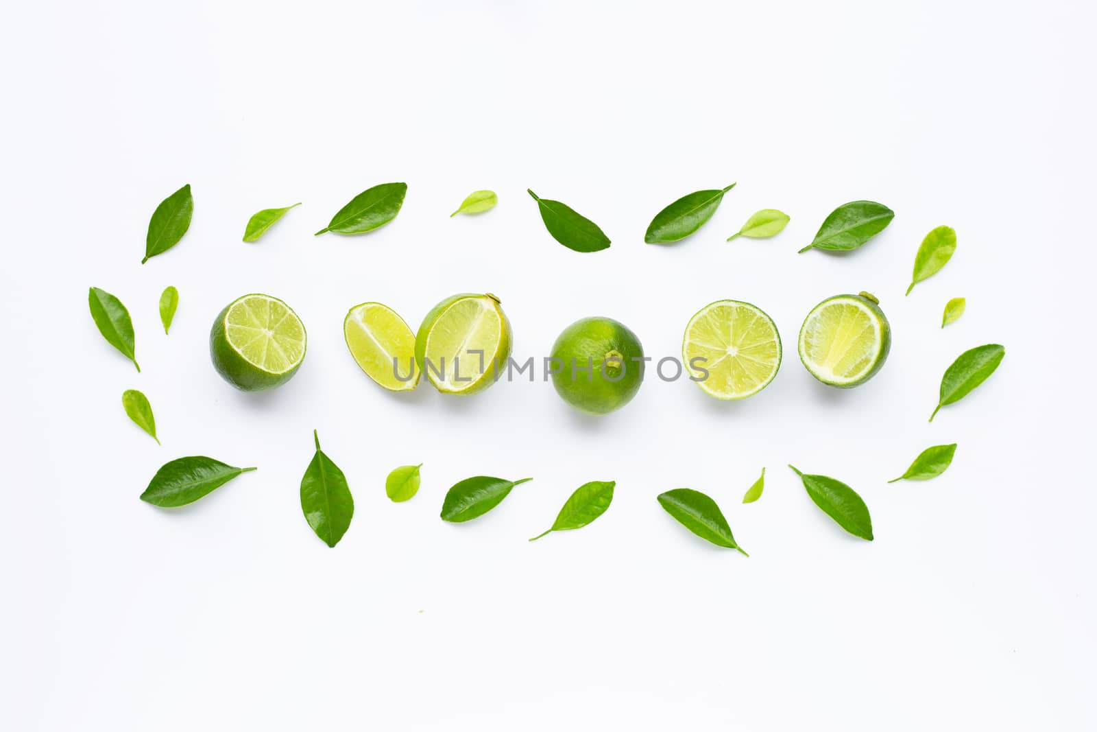 Limes with leaves isolated on white background.