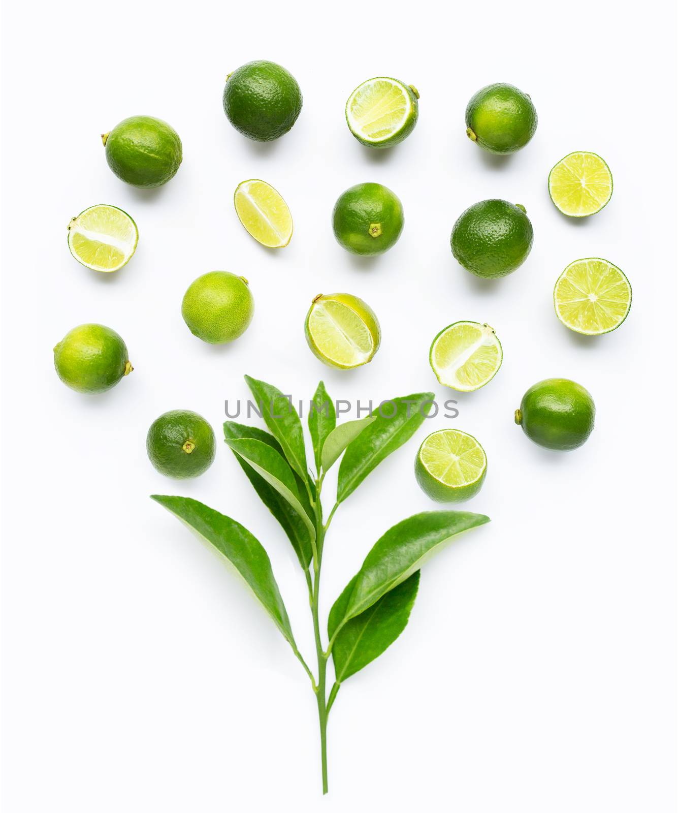 Limes with leaves isolated on white background.