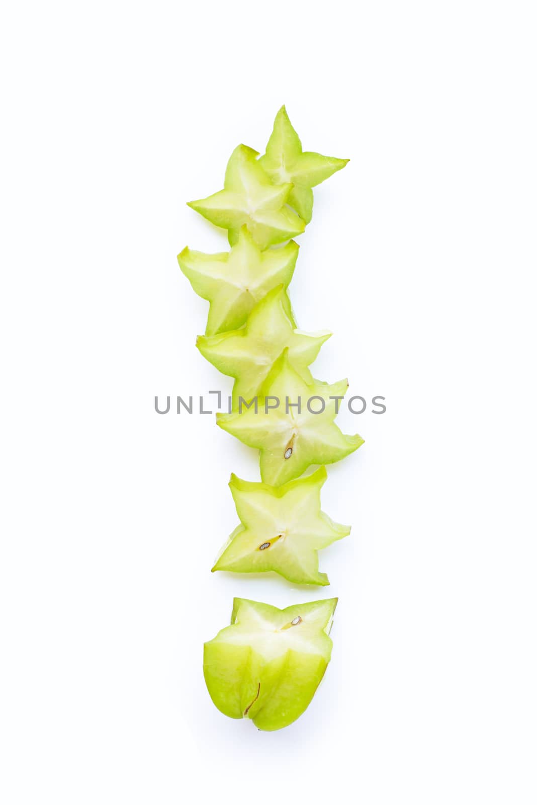 Ripe star fruit on white background. Top view