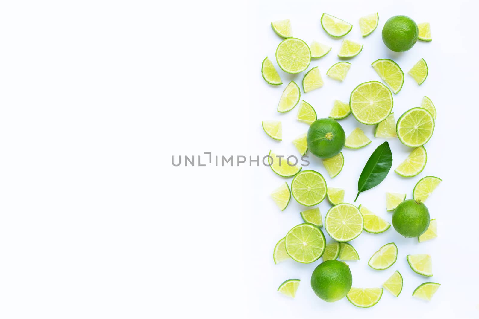 Fresh lime with  slices isolated on white background. Copy space
