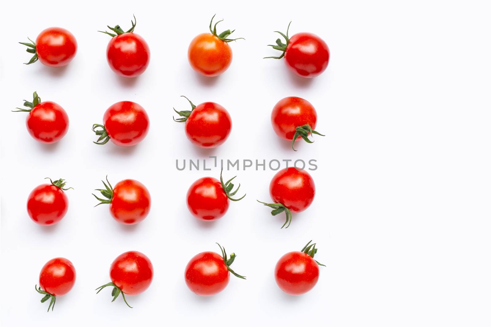 Fresh cherry tomatoes on white background. 