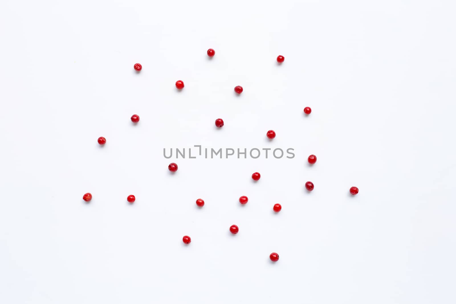 Red peppercorns  on white background.