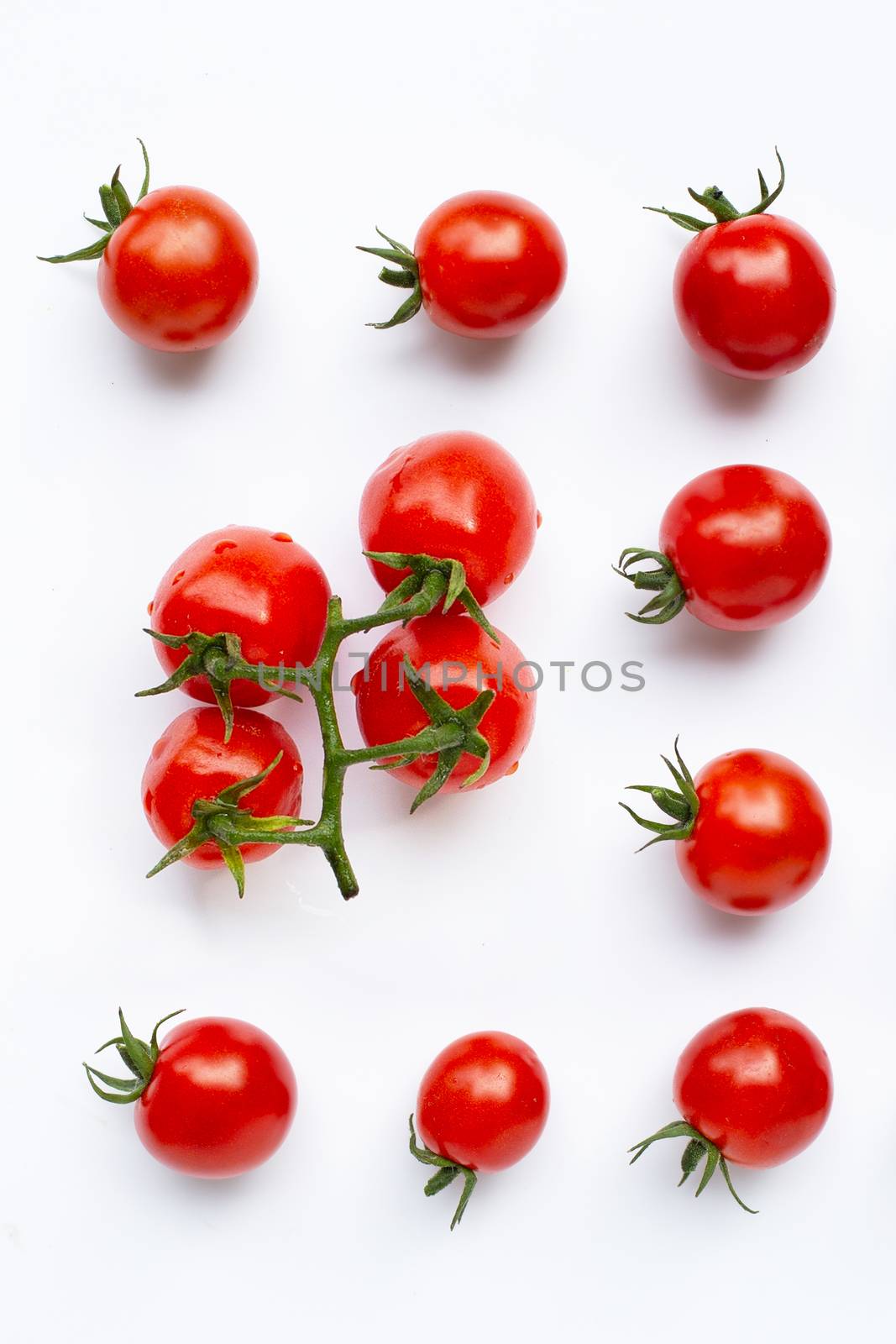 Fresh tomatoes, whole and half cut isolated on white background. by Bowonpat