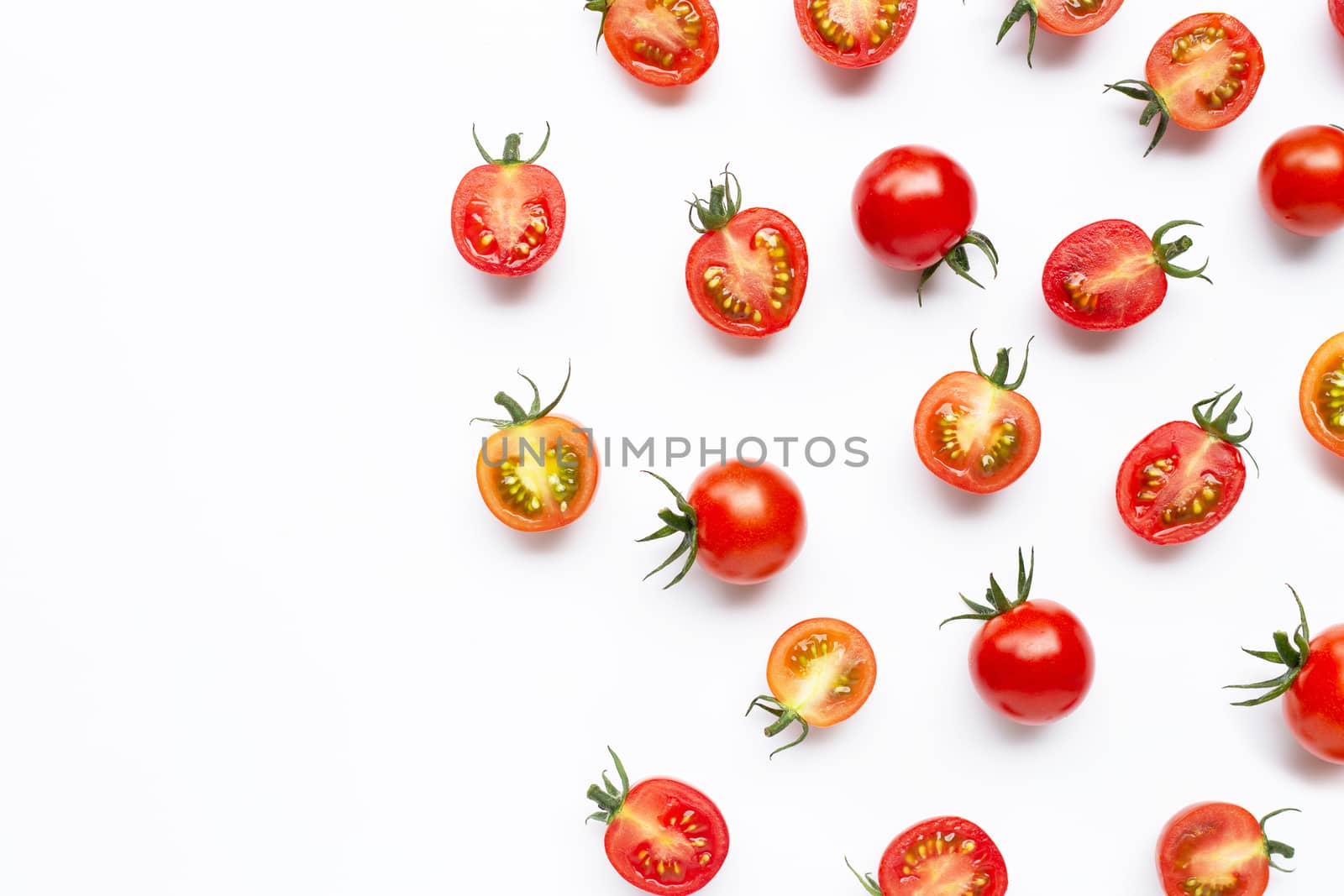 Fresh tomatoes, whole and half cut isolated on white background. Copy space