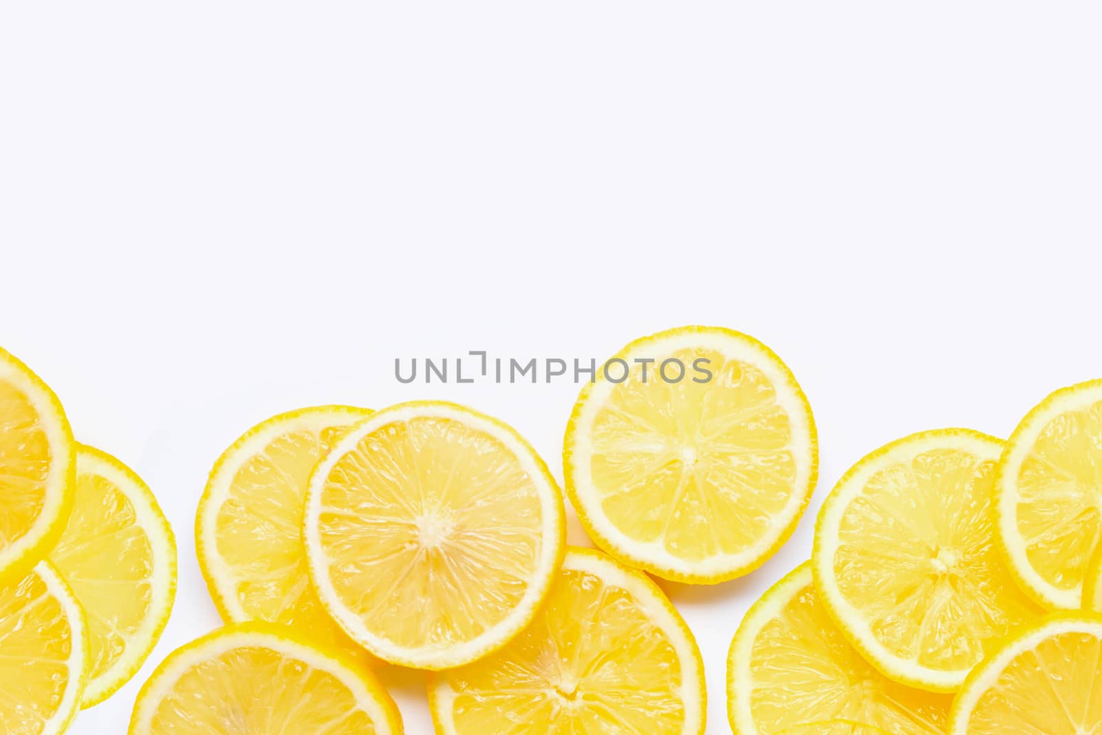Frame made of fresh lemon with slices on white background. Copy space