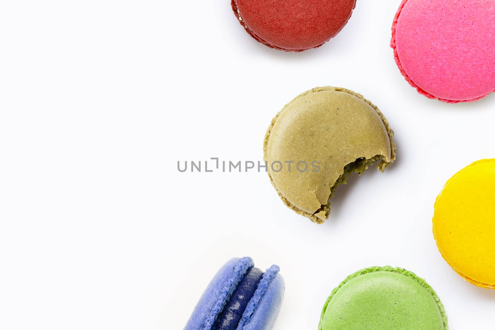 Colorful macarons isolated on white background.