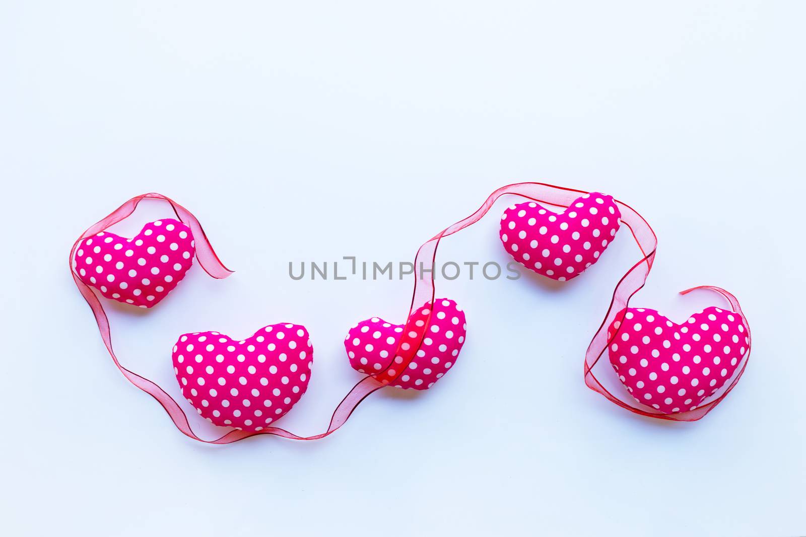 Valentine's hearts with ribbon on white background