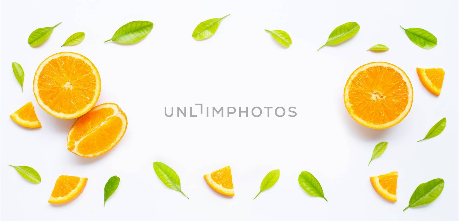 Frame made of fresh orange fruit with green leaves on white by Bowonpat