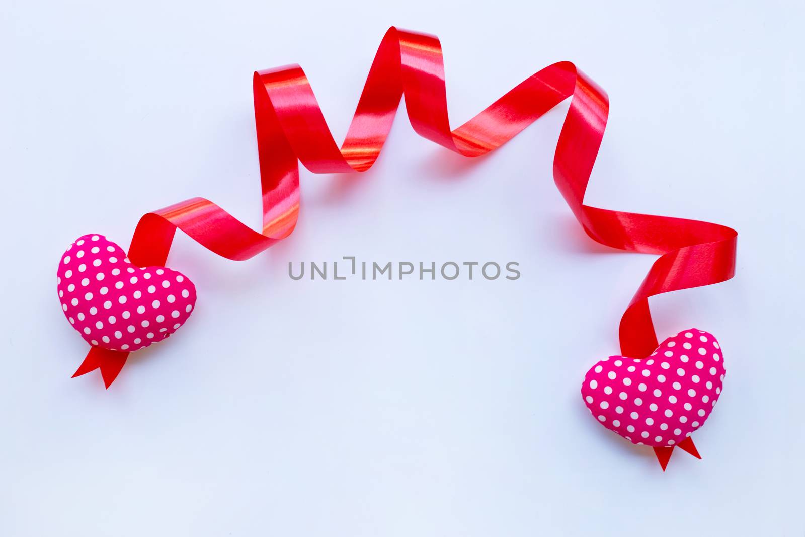 Valentine's hearts with ribbon on white background