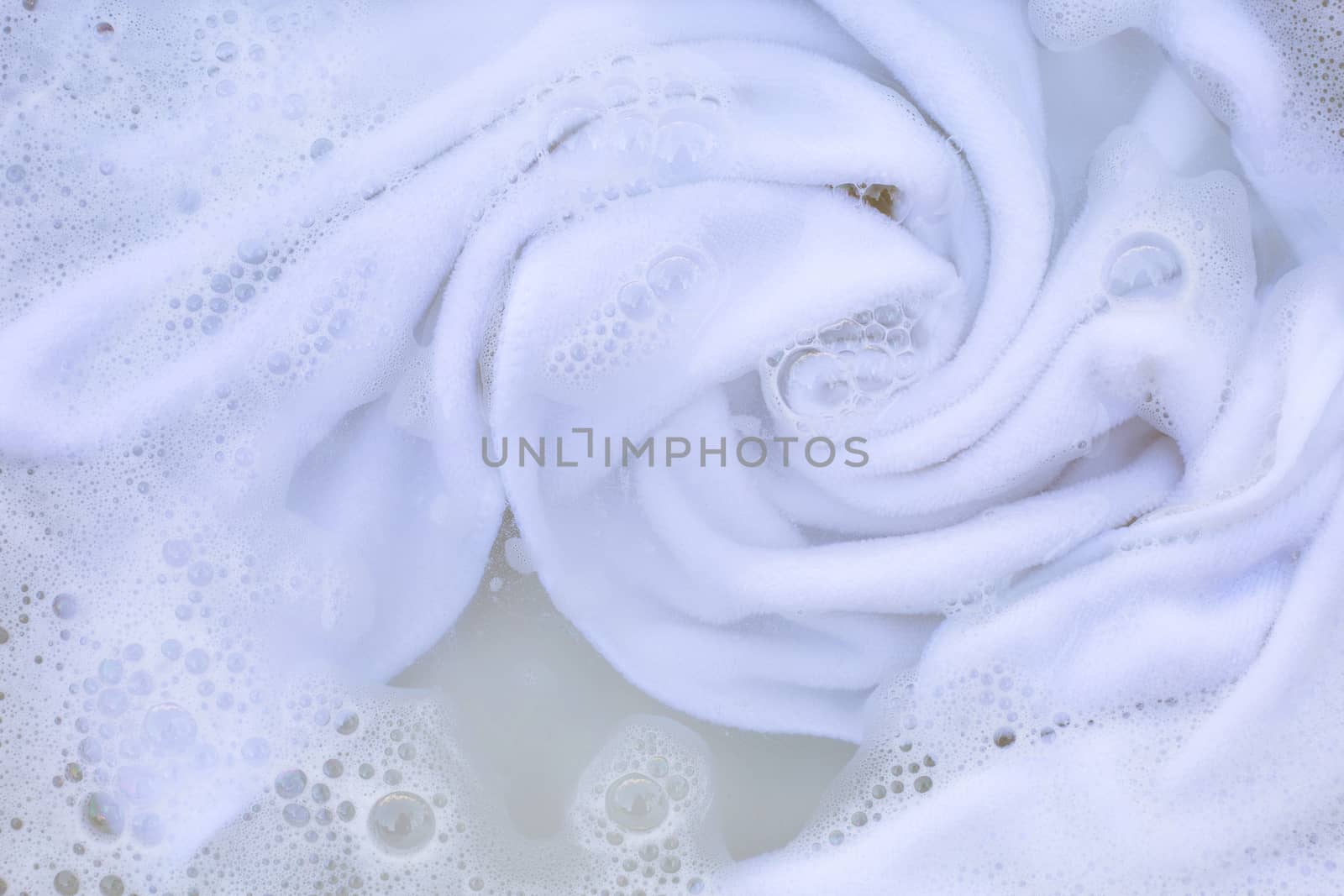 Soak a cloth before washing, white cloth