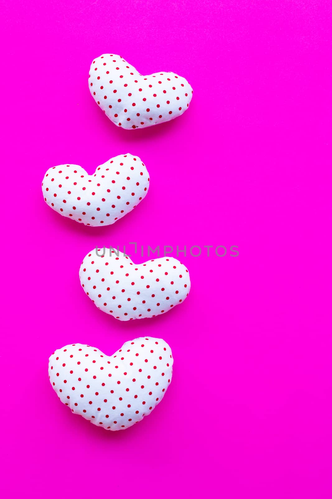 Valentine's hearts on pink background by Bowonpat