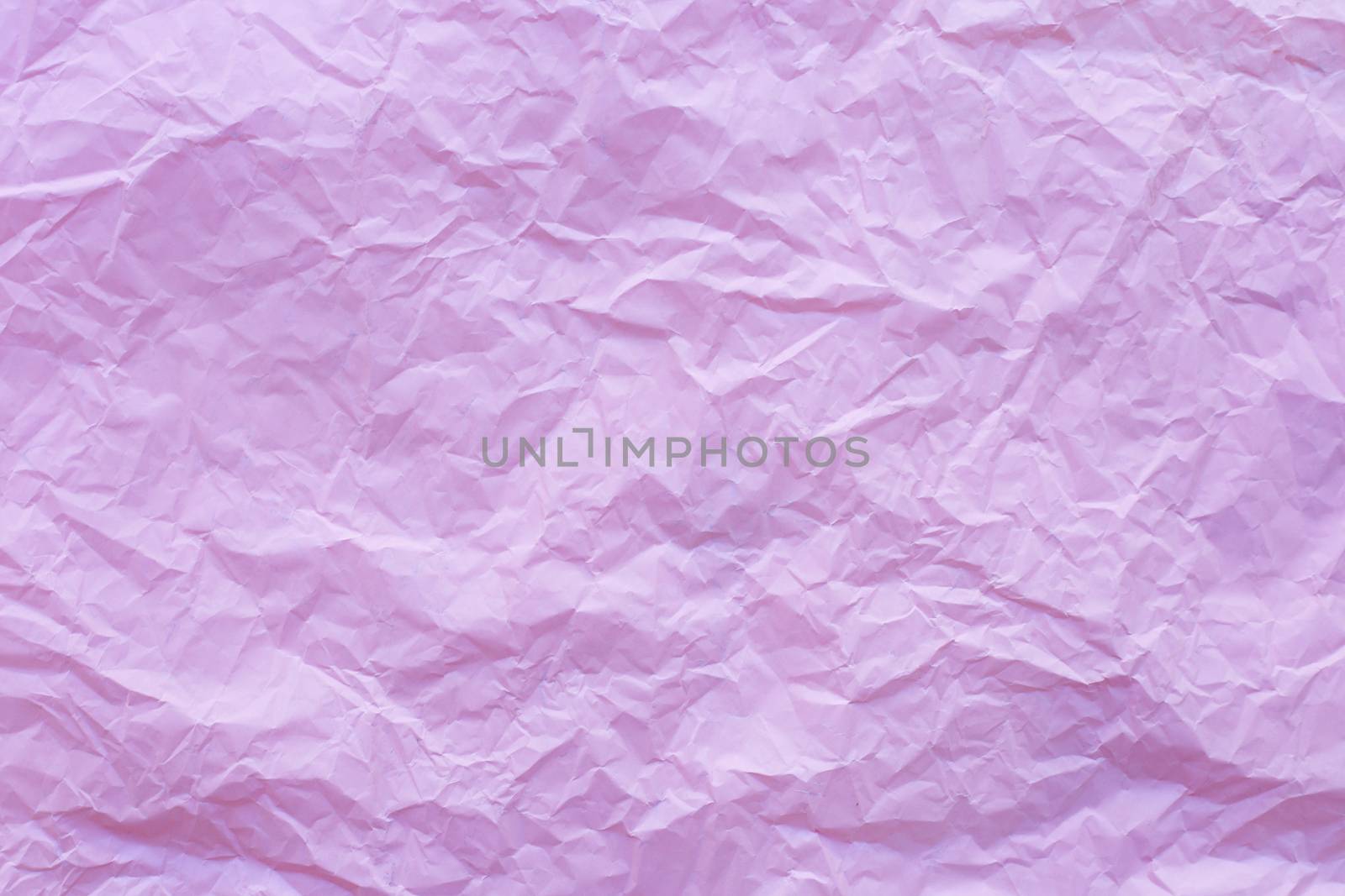 Pink crumpled recycle paper background
