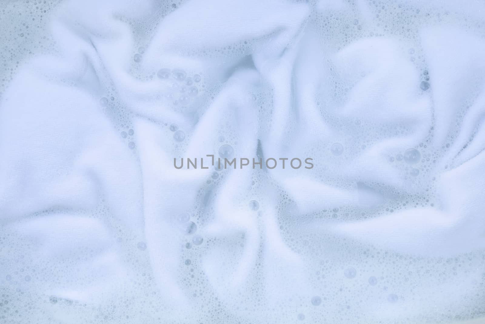 Soak a cloth before washing, white cloth