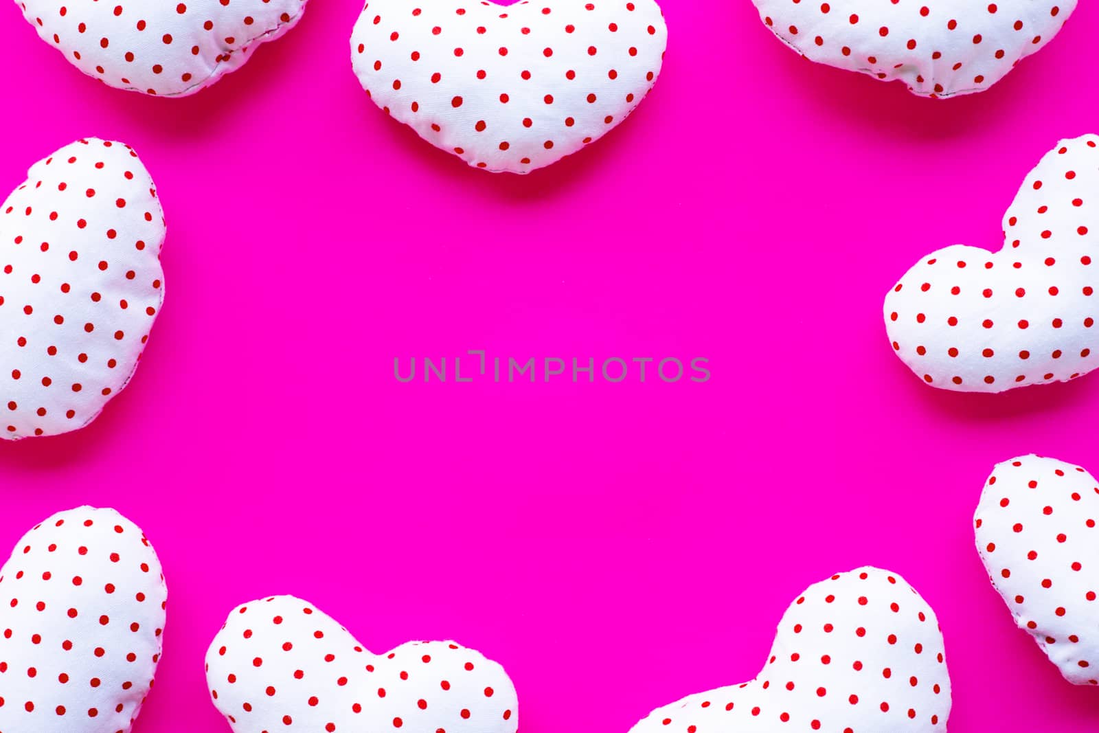 Frame of valentine's hearts on pink background, Top view