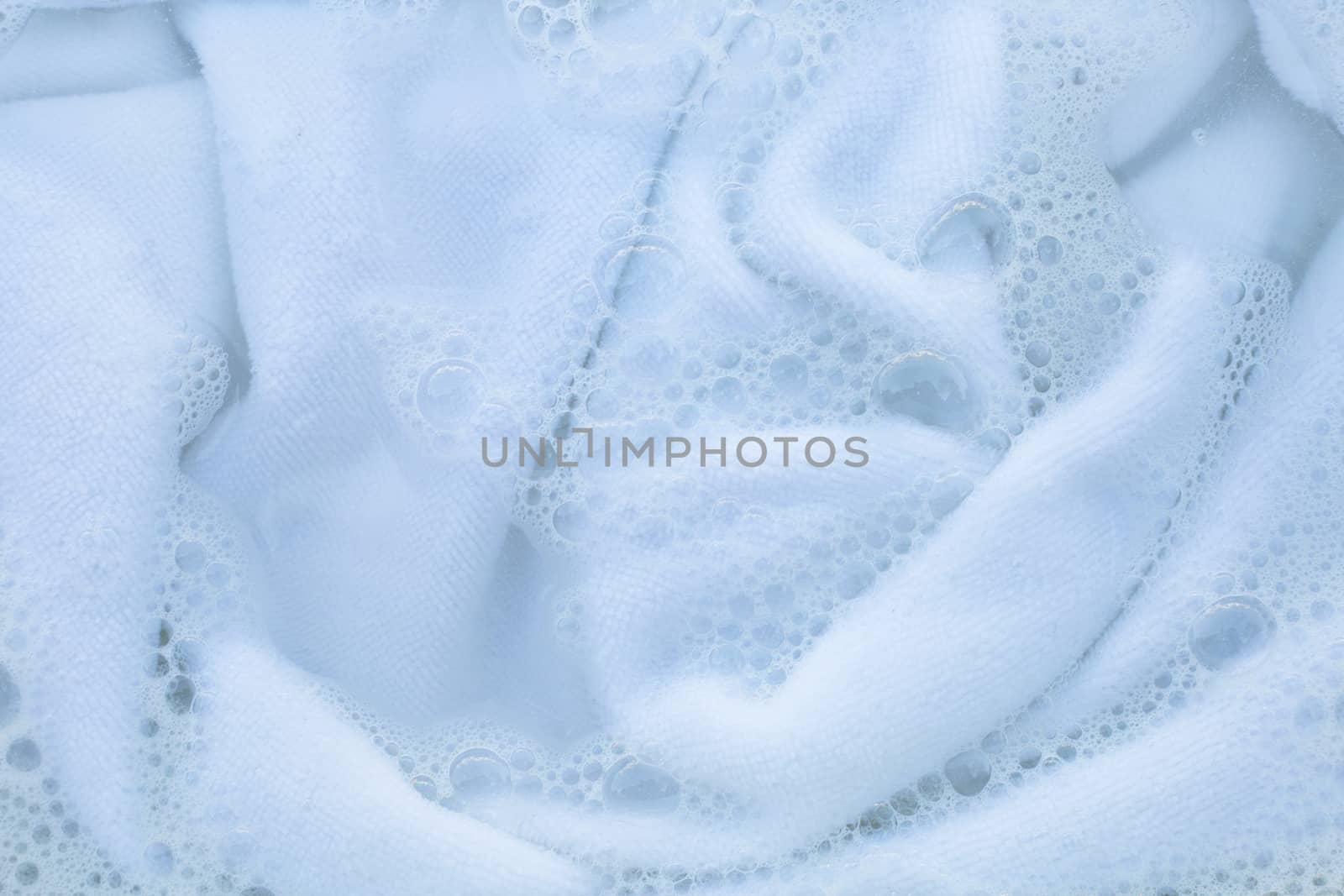 Soak a cloth before washing, white cloth
