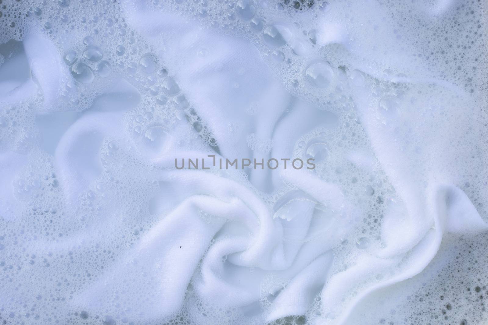 Soak a cloth before washing, white cloth