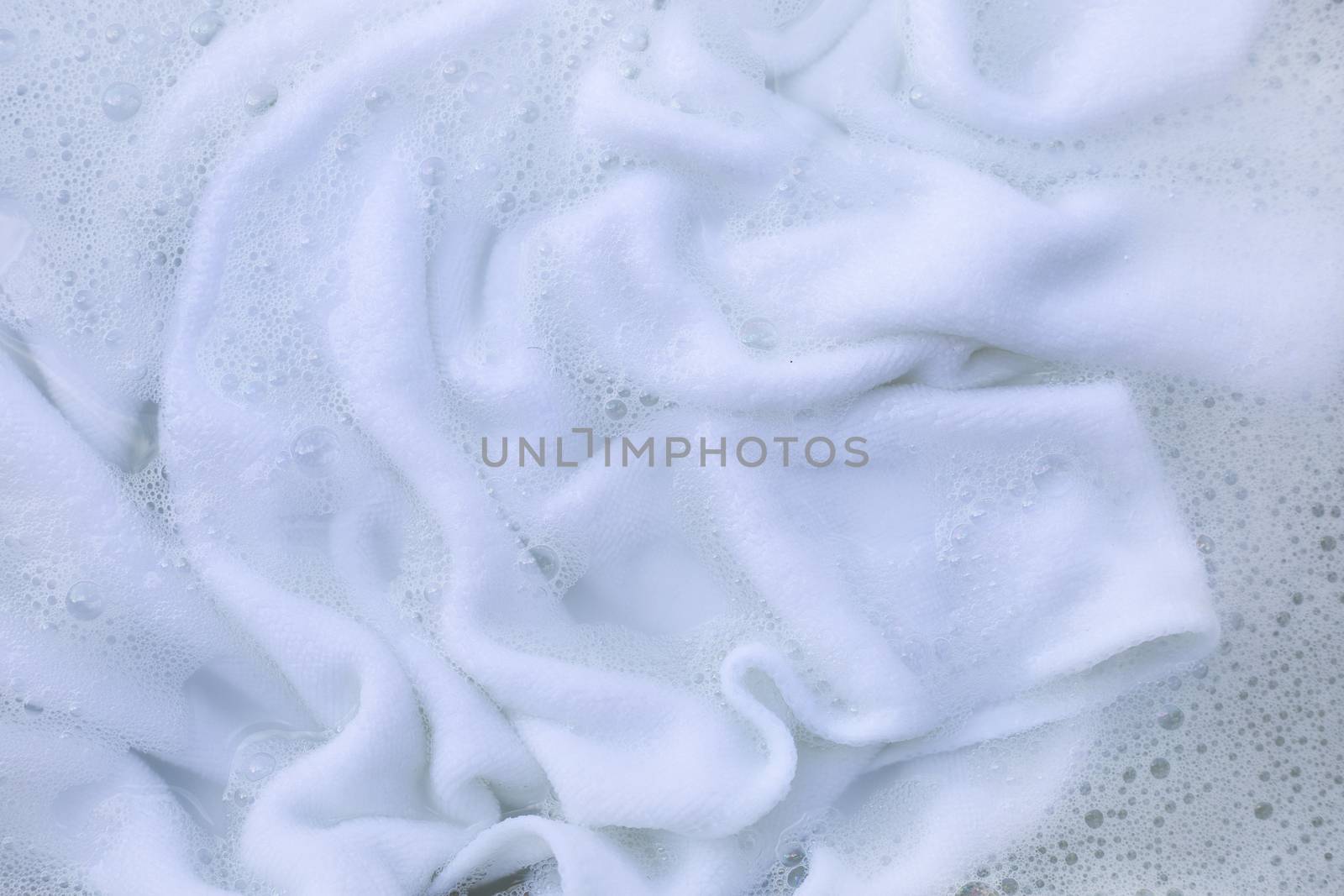 Soak a cloth before washing, white cloth